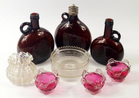 Three Regency brown glass spirit flagons