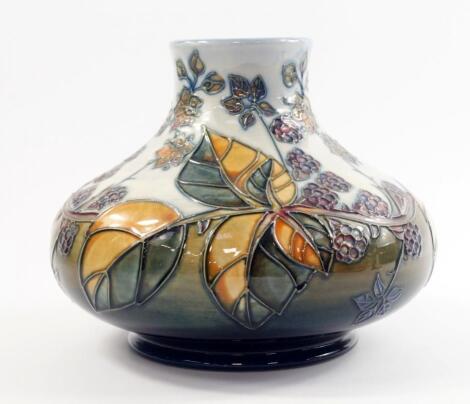 A Moorcroft pottery vase decorated in the Blackberries pattern