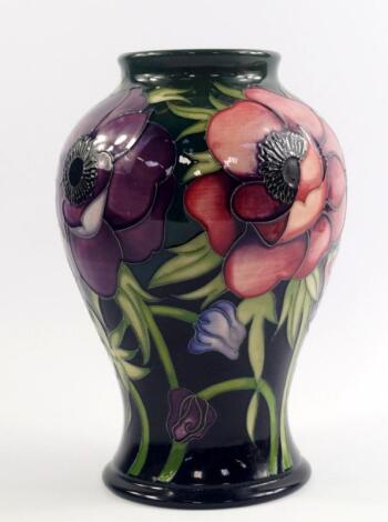 A Moorcroft pottery vase decorated in the Anemone Tribute pattern