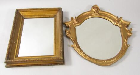 A 19thC shield shaped gilt wood wall mirror