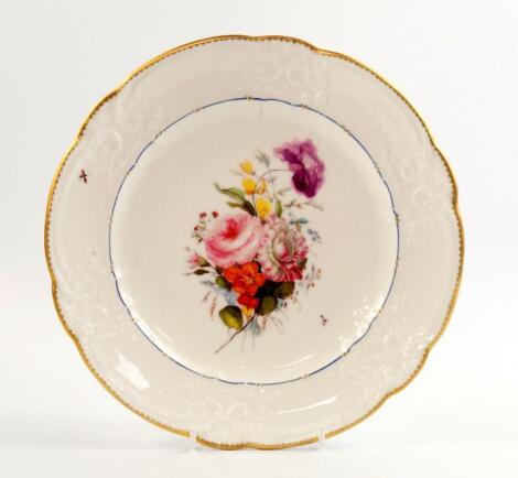 A Nantgarw early 19thC porcelain plate painted with a spray of flowers