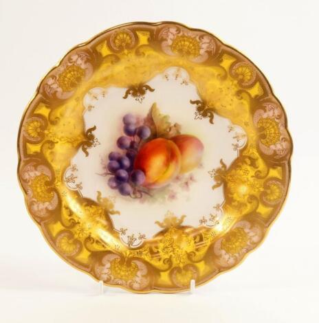 A Royal Worcester porcelain cabinet plate painted by R Sebright with fruit