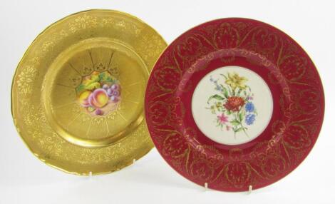 A Royal Worcester porcelain plate painted with fruit by H Henry