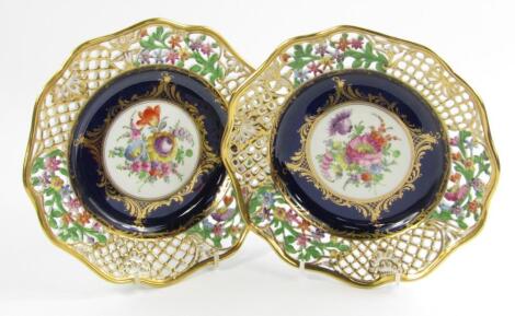 A pair of Meissen porcelain plates painted with flowers