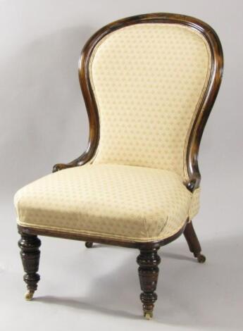 A Victorian oak balloon back nursing chair