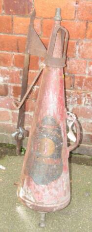 A MiniMax 2 gallon bygone fire extinguisher.