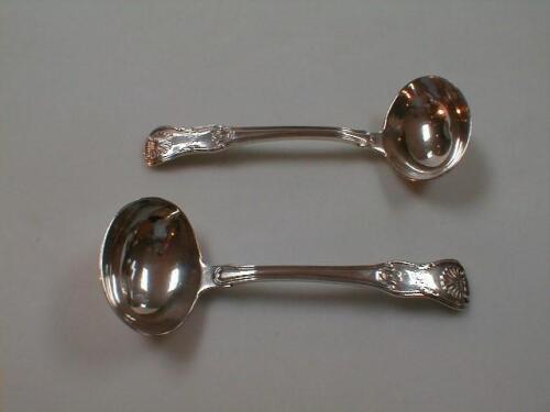 A pair of George III Irish silver sauce ladles