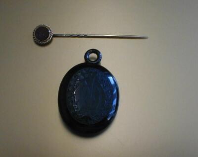 A Victorian jet memorial locket with engraved front cover