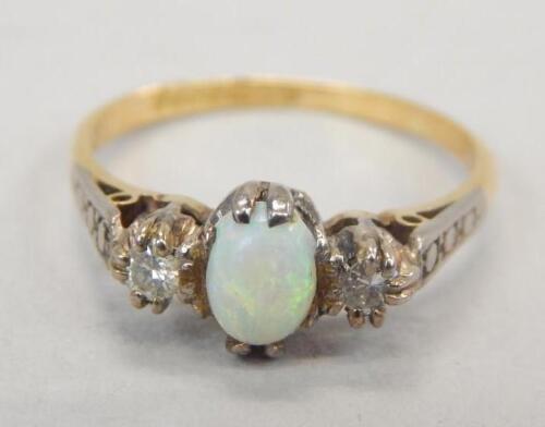 An 18ct gold opal and diamond dress ring