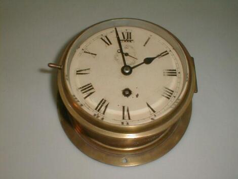 A brass cased ship's bulkhead clock with 6" dial