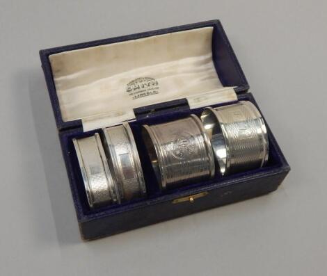 Four engine turned silver napkin rings