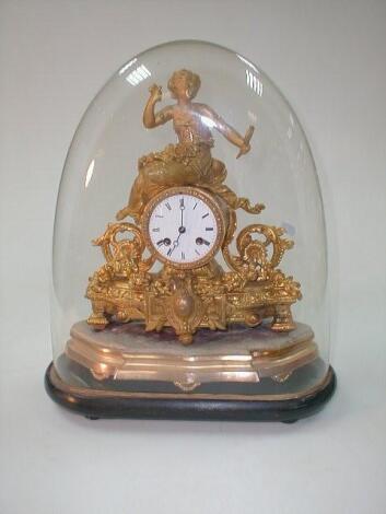 A 19thC French gilt metal figural mantel clock with a seated female surmounting