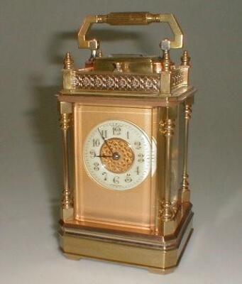 A French brass eight day striking repeater carriage clock