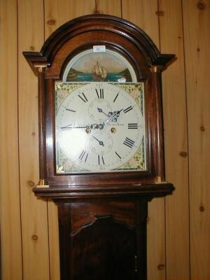 A mahogany longcase clock with domed and pillared hood