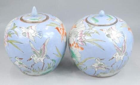 A pair of modern Chinese jars and covers