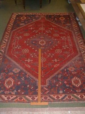 A Persian Shiraz Rug, 6' 9" x 9' 7"