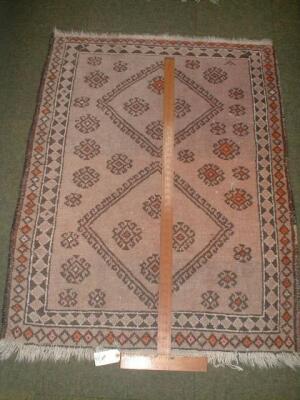 A beige ground rug 4'4" X 3'4"