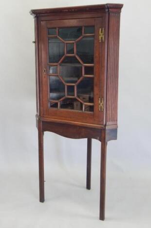 A George III mahogany corner cabinet