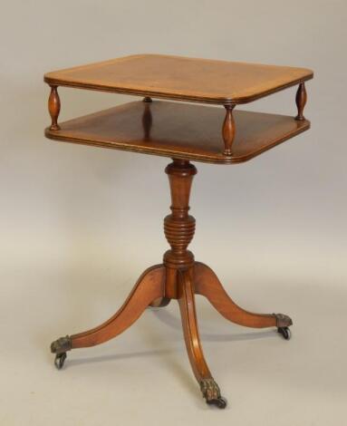 A reproduction yew veneered two tier table