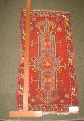 A red ground Turkish rug 3'4" X 1'9"