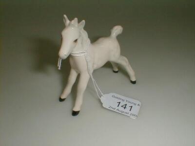 A Beswick figure, Royal Doulton stamp, No