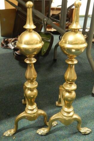 A pair of 20thC brass fire dogs