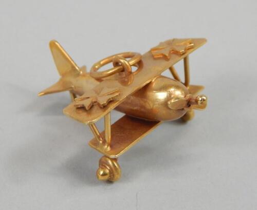 A 9ct gold bi-plane charm or pendant