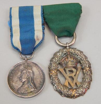 Two medals. A silver Victoria Volunteer medal