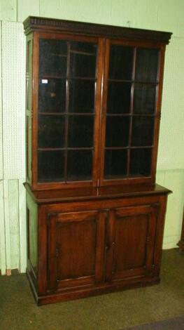 A 19thC mahogany cabinet bookcase the upper parts having deep dentil moulded cornice