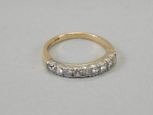 A ladies 9ct gold half eternity ring