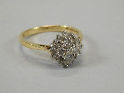 A ladies diamond cluster ring