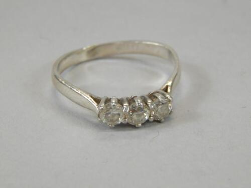 A ladies three stone dress ring