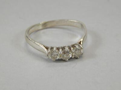 A ladies three stone dress ring