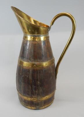 A late 19th/early 20thC oak and brass coopered jug