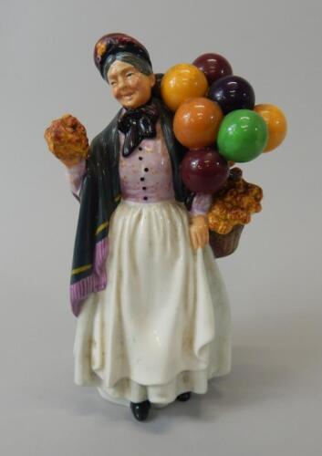 A Royal Doulton porcelain figure of Biddy Penny Farthing