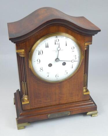 An early 20thC mahogany boxwood strung and checker banded mantel clock