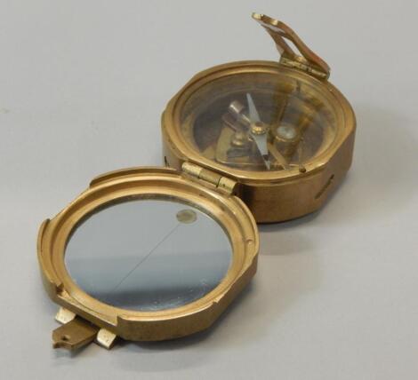 A reproduction brass nautical compass