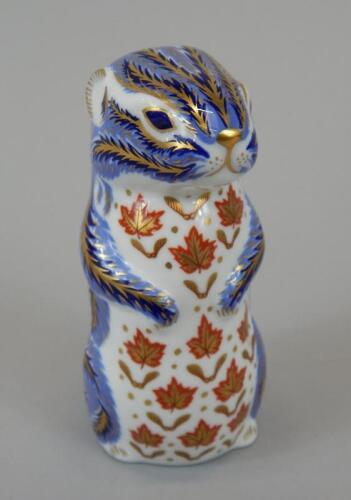 A Royal Crown Derby otter paperweight.