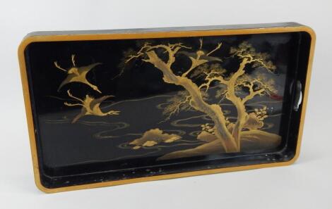 An oriental black lacquer tray