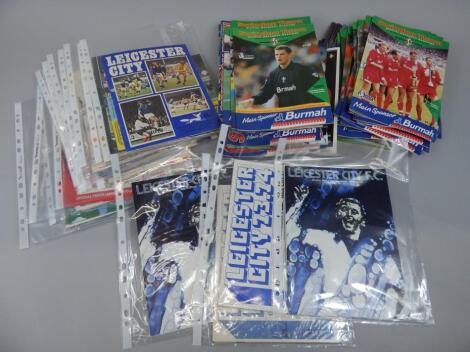 A quantity of football programmes