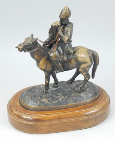 Late 19th/early 20thC Russian School. Figure of a Cossack and his lady on horseback