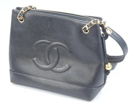 A Chanel black leather handbag