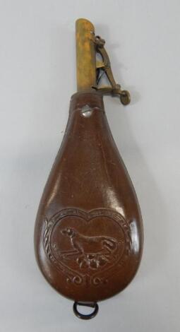 A brass and leather powder flask