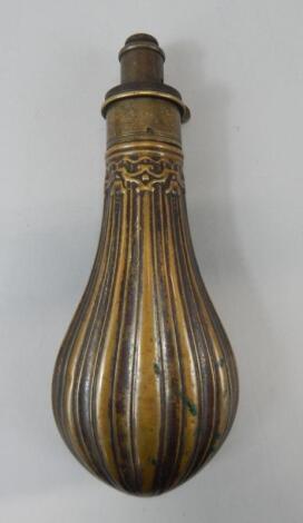 A brass powder flask