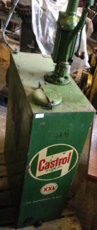 A Castrol oil tank and pump