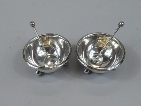 A pair of George V circular silver open salts