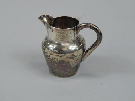 A late Victorian small silver cream jug