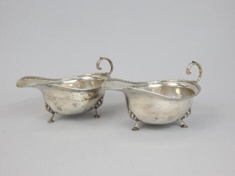 A pair of George V silver sauce boats