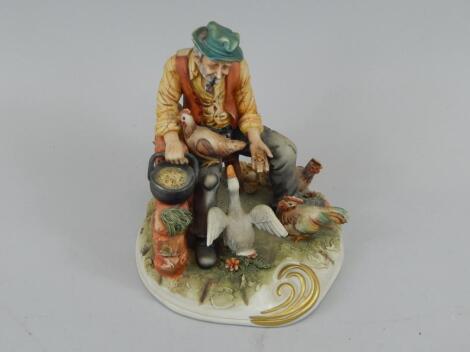 A Capodimonte porcelain figure of Feeding Time