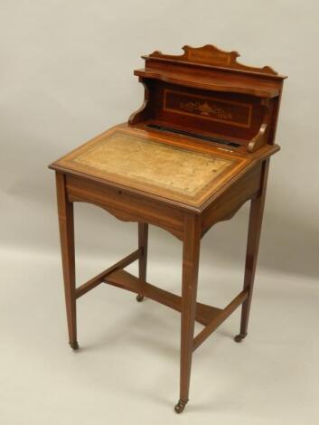 An Edwardian mahogany and simulated marquetry desk